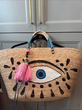 Straw Eye Tote Bag with Pink Tassel Accent